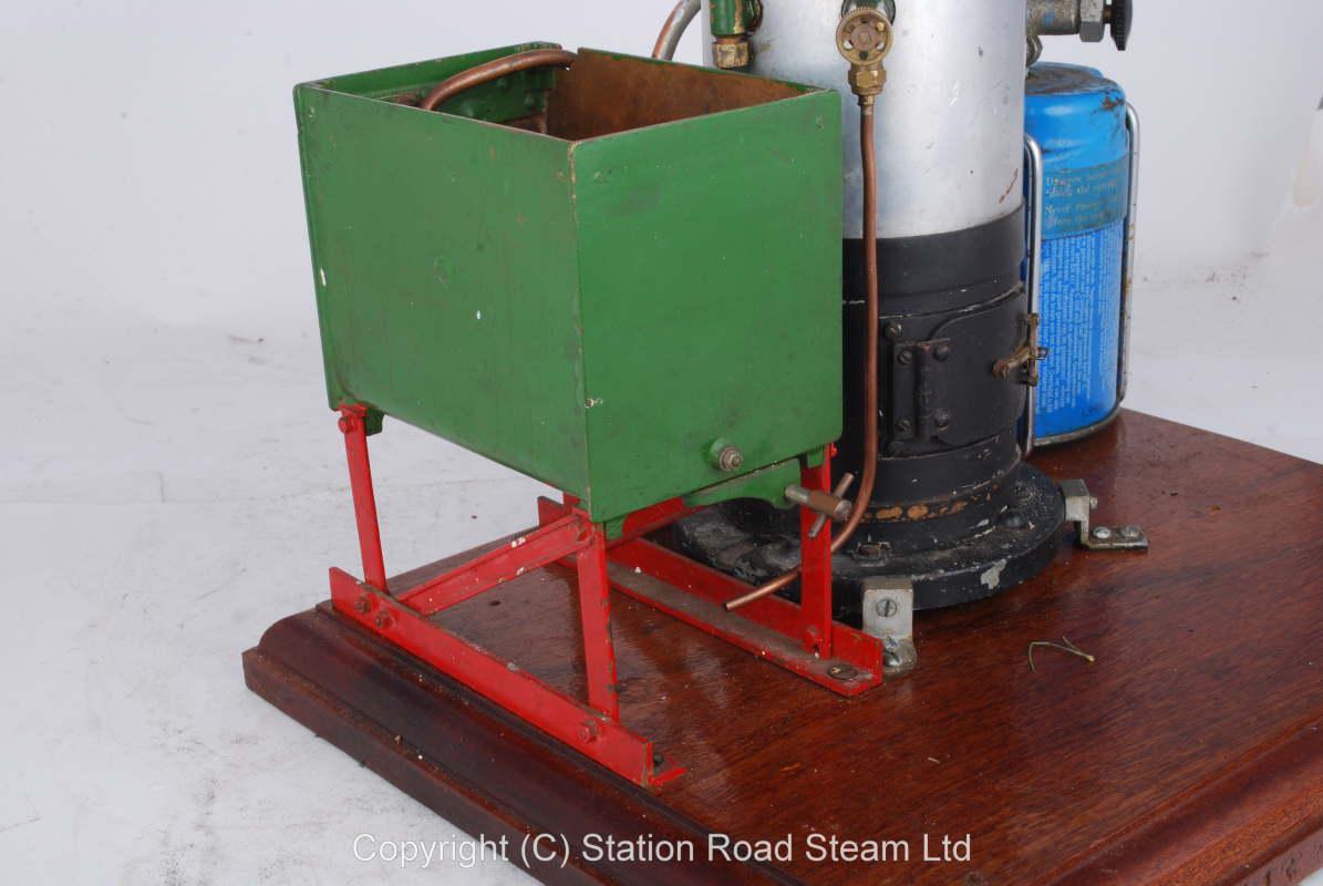 Gas fired boiler with water tank and hand pump