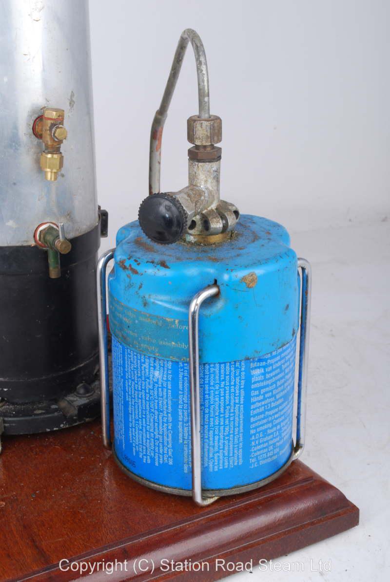 Gas fired boiler with water tank and hand pump