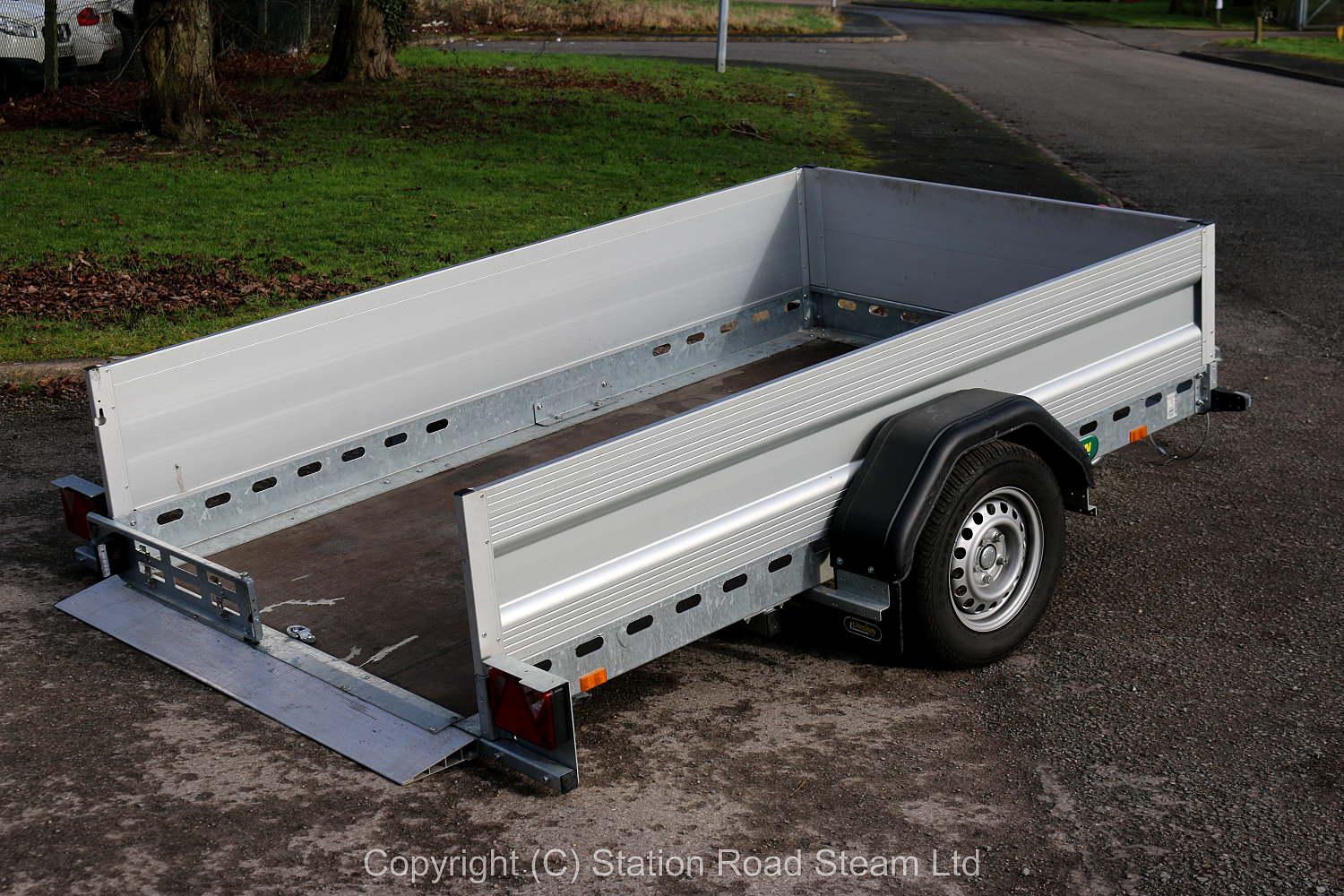 Two wheel tilt bed trailer