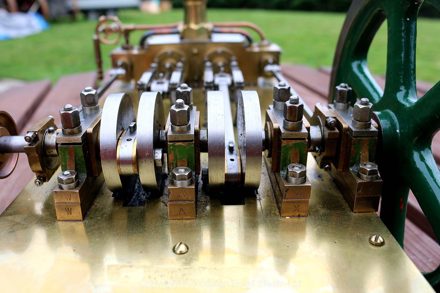 Horizontal twin mill engine on brass supports with hardwood base