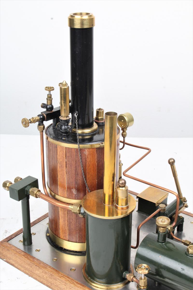Gas-fired vertical boiler with hand pump and water tank