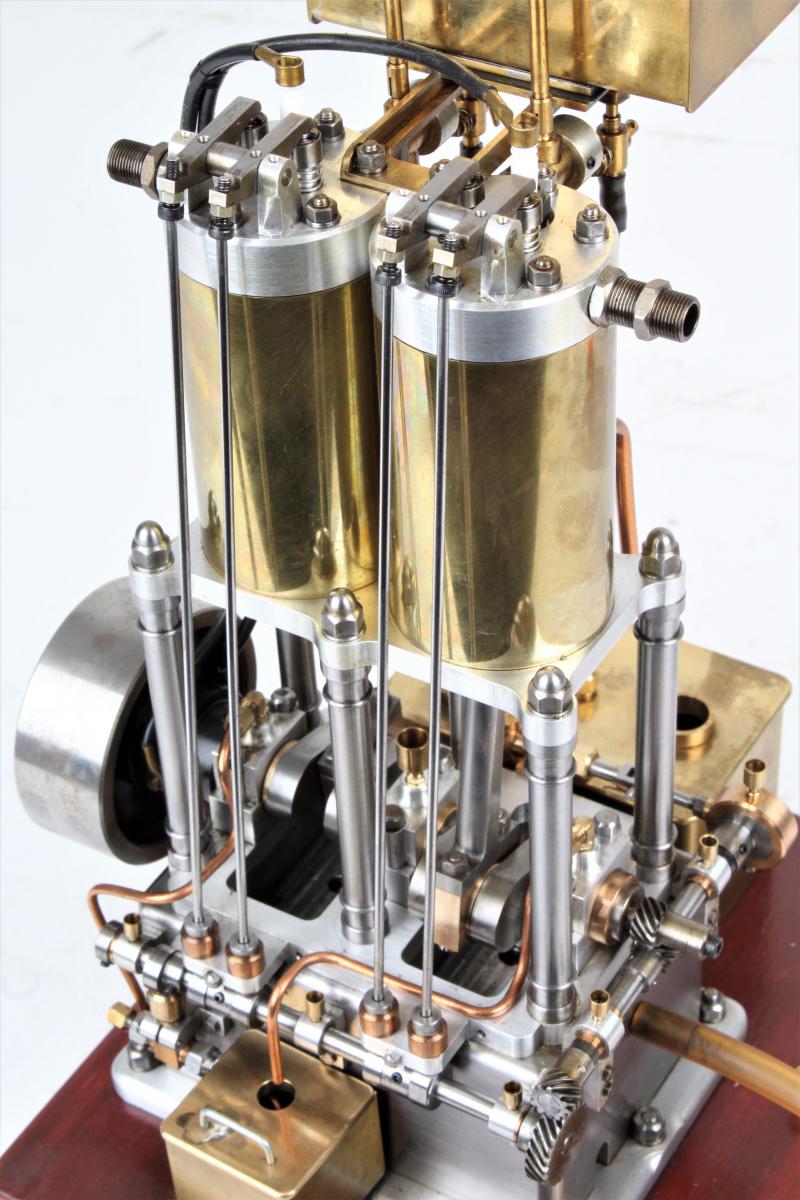 Open crank vertical twin internal combustion engine